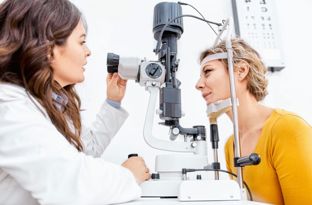 An eye doctor performs an eye exam to update their patient's prescription so they can get new eyeglasses.